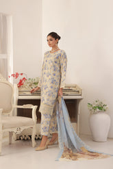 ZARNAZ - Woman in a Gray with Creamy White Base floral dress with a matching dupatta in a decorated room