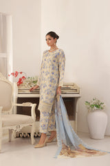 ZARNAZ - Woman in a Gray with Creamy White Base floral dress with a matching dupatta in a decorated room