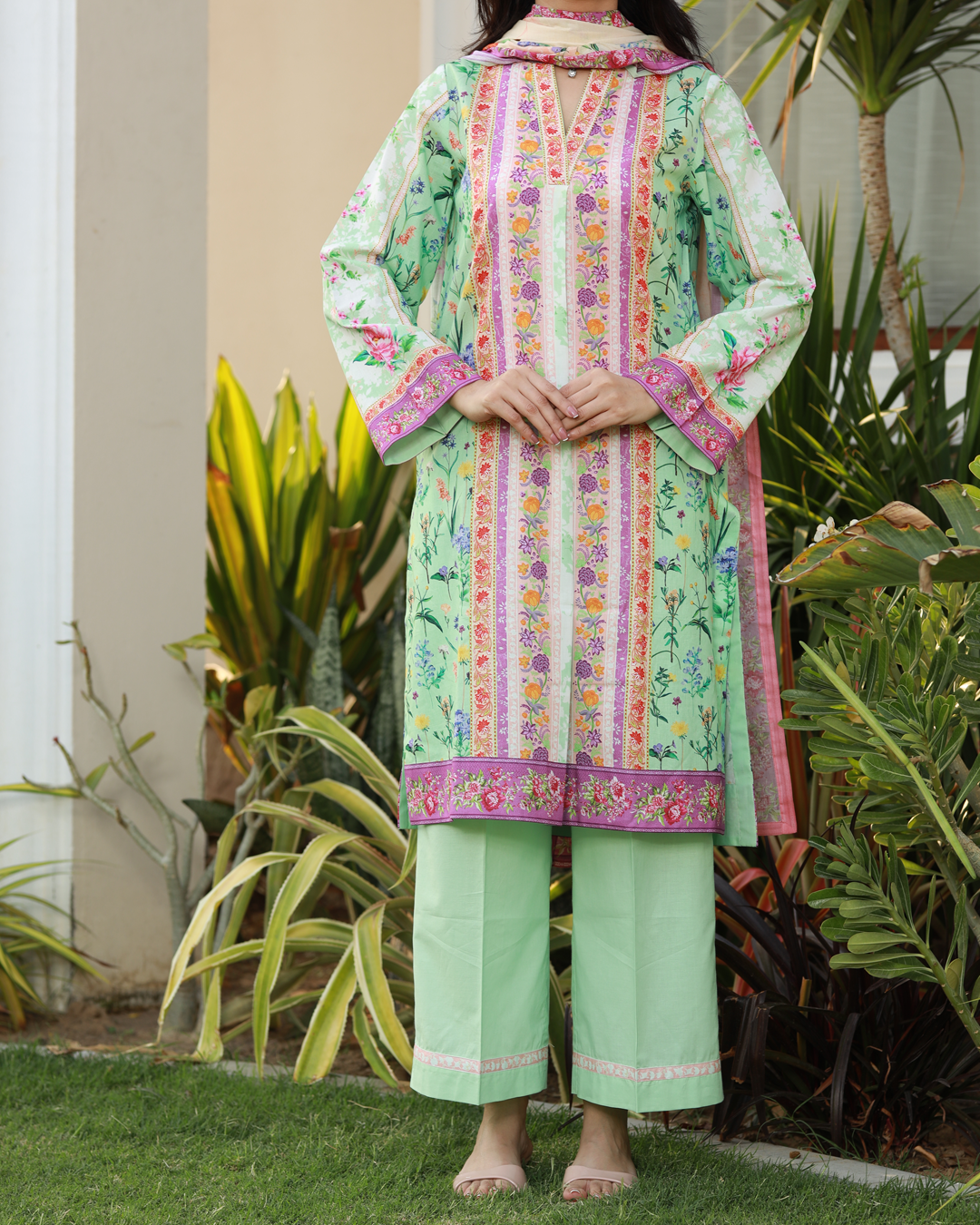 Colors of Confidence Lawn Digital Print Unstitched Suit Set in powder green with vibrant multi-panel floral design, three-piece ethnic outfit for women.