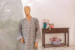 Mannequin wearing a floral dress with a decorative table and flowers in the background