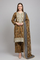 Woman wearing a traditional embroidered outfit with a dupatta on a gray background