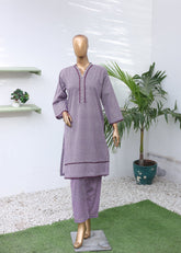 Mannequin wearing a purple outfit with a white background and plant