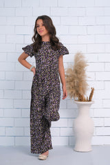 Sprinkles Stitched 1 Piece Summer Jumpsuit Kids Collection'2025-Black Allover Lavender Floral Print Butterfly Sleeve Shirred Jumpsuit
