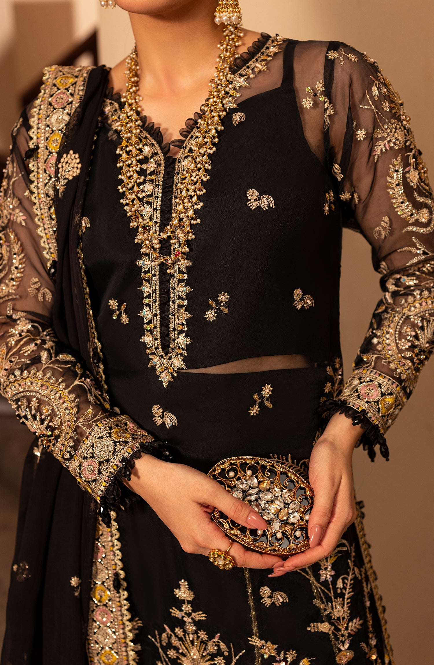Close-up of model displaying fabric details of Aylin Dusky formal dress