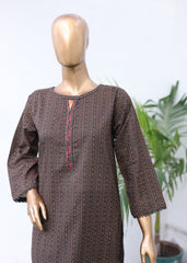 Mannequin wearing a brown textured outfit with a blurred background