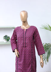 Mannequin wearing a patterned pink outfit with a white background