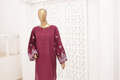 Maroon dress with white patterns on a mannequin against a decorative white wall.