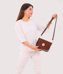 RTW Creation - Dark brown suede saddle bag with twist lock