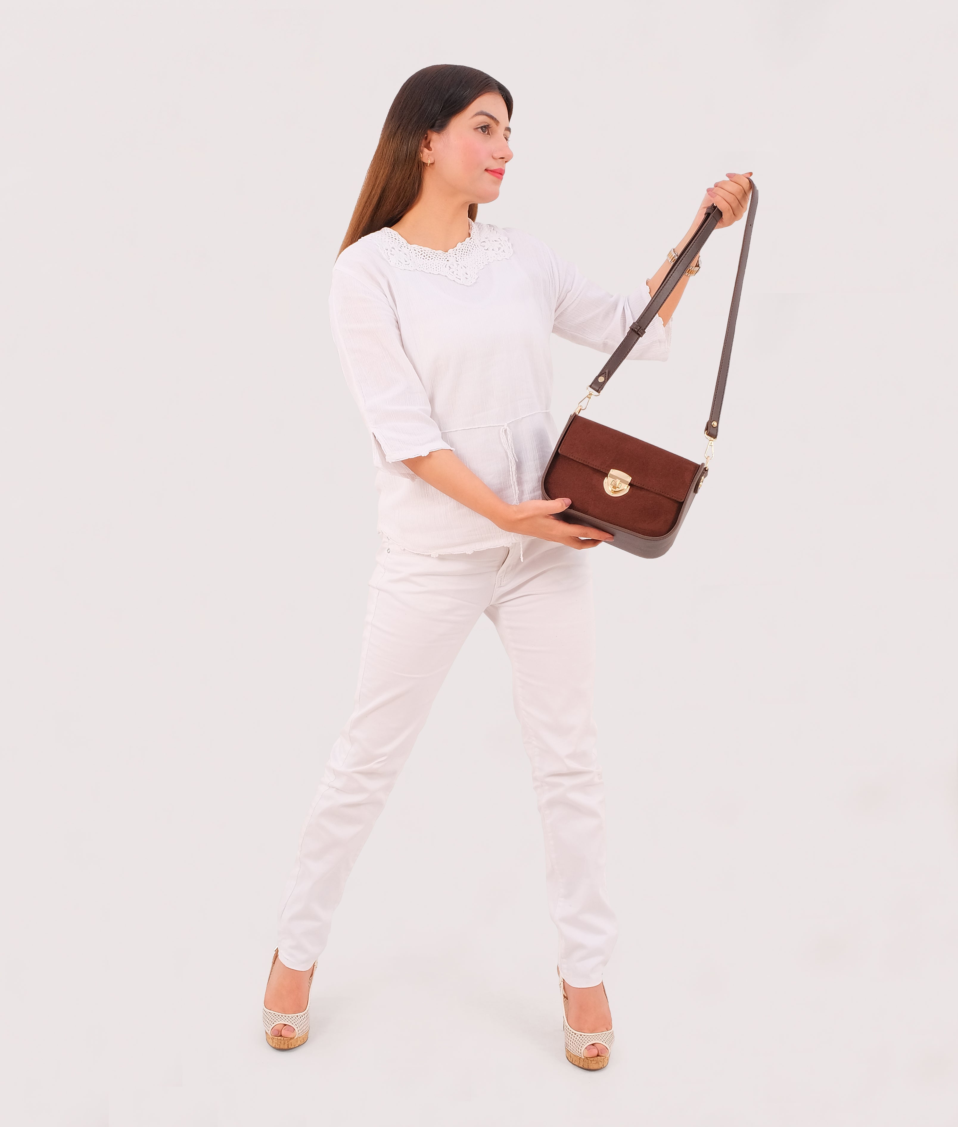 RTW Creation - Dark brown suede saddle bag with twist lock