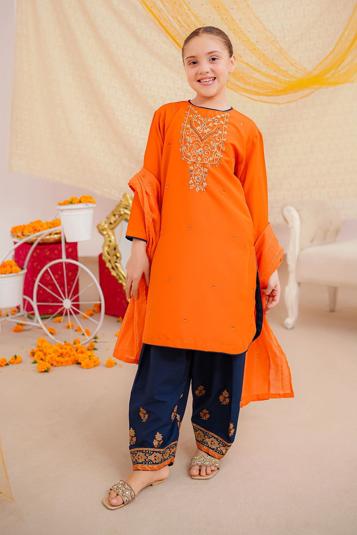 Brighten any occasion with our Orange Dress for Girls. A stylish party wear embroidered suit featuring soft fabric